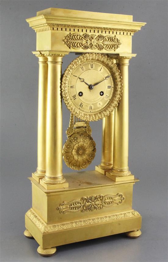 A second quarter of the 19th century French ormolu portico clock, 19in.